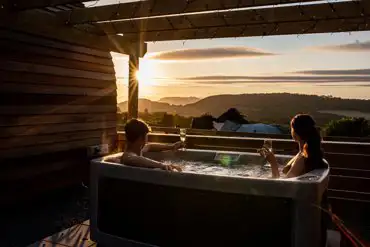 Glamping pod hot tub at sunset