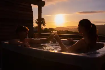 Glamping pod hot tub at sunset
