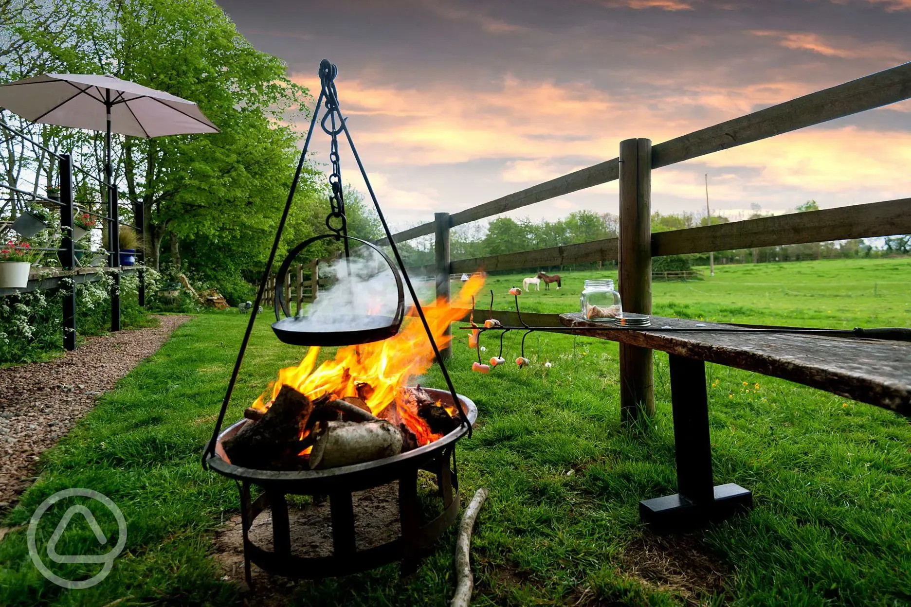 Outdoor fire pit with view of horses