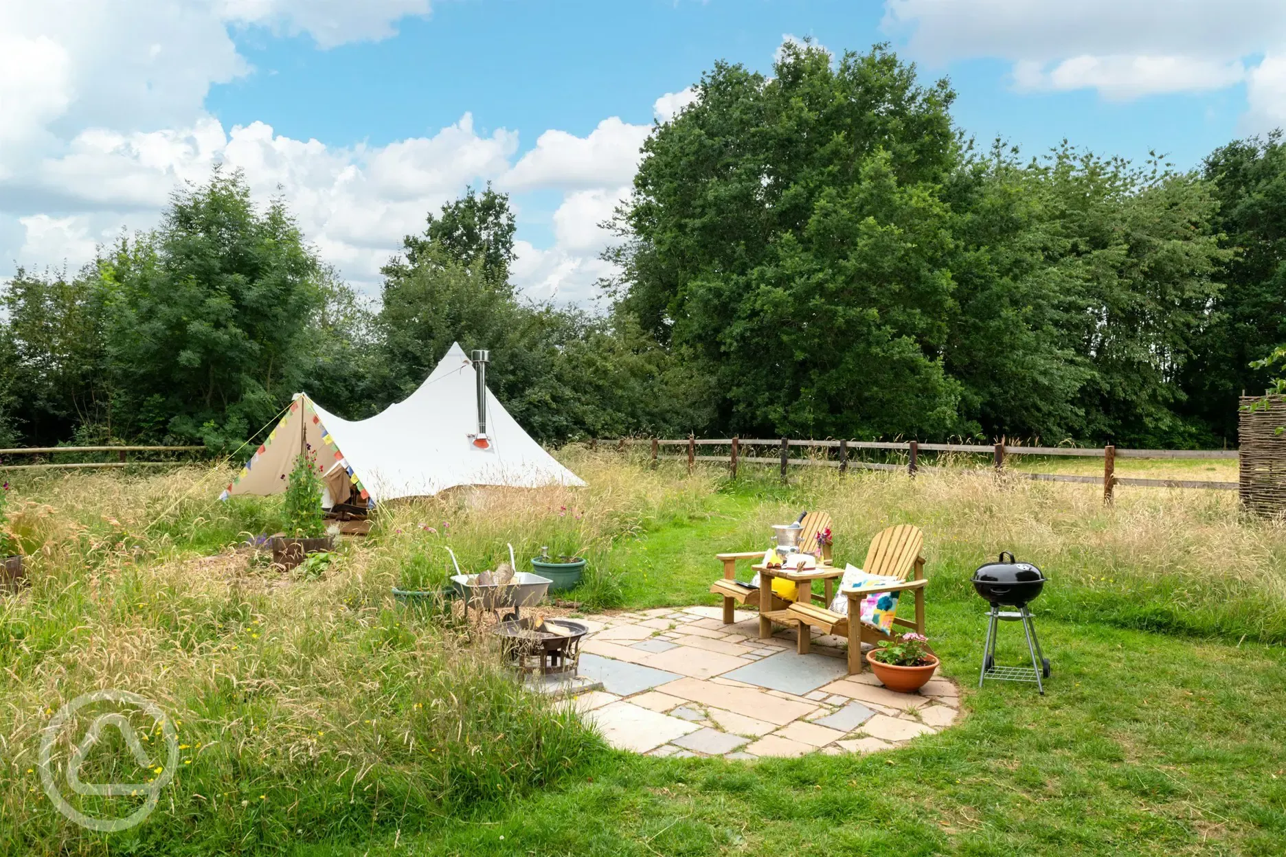 Furnished bell tent and fire pit