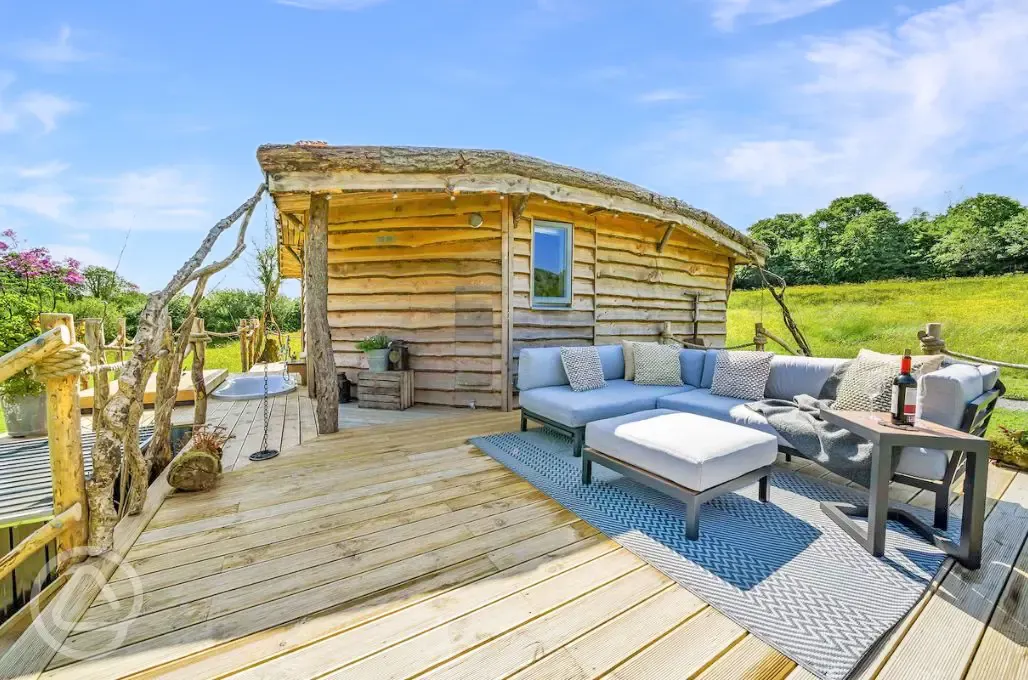 Glamping cabin exterior with furnished decking