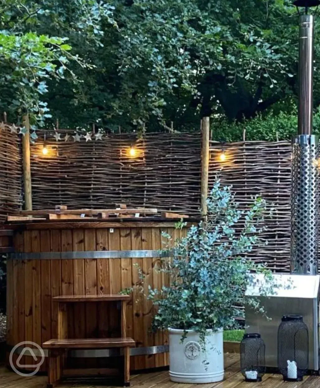 Wood fired hot tub at night