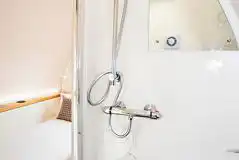 Glamping pod ensuite with a toilet, shower, and handwashing sink Glamping pod ensuite with a toilet, shower, and handwashing sink