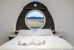 Premium glamping pod king size bed