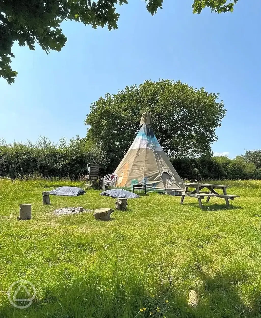 Tipi with seating and campfire