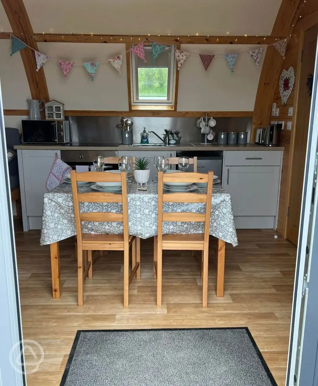 Large ensuite glamping pod dining area and kitchenette