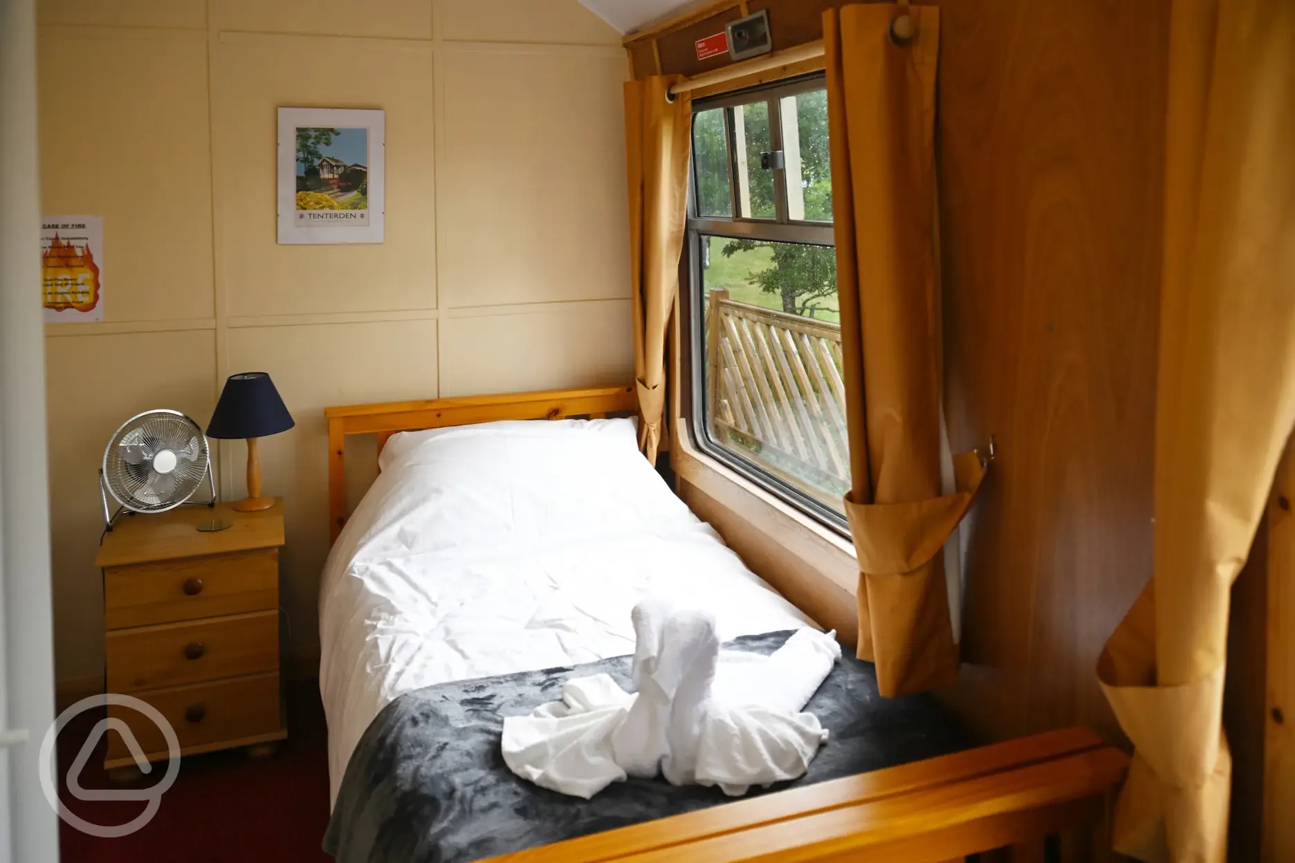 Single bed in glamping coach