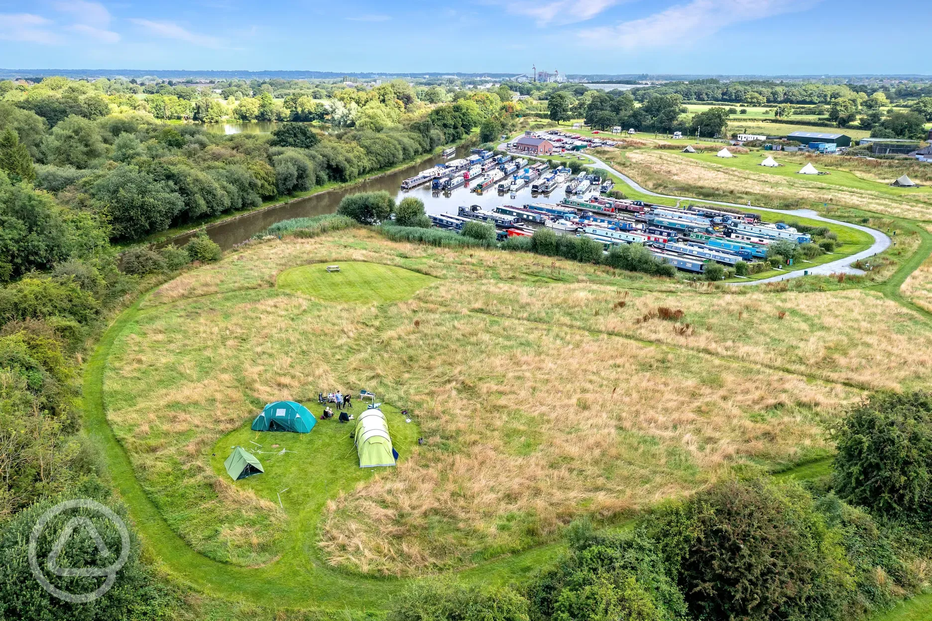Aerial of the non electric grass tent pitches beside Oakwood Marina