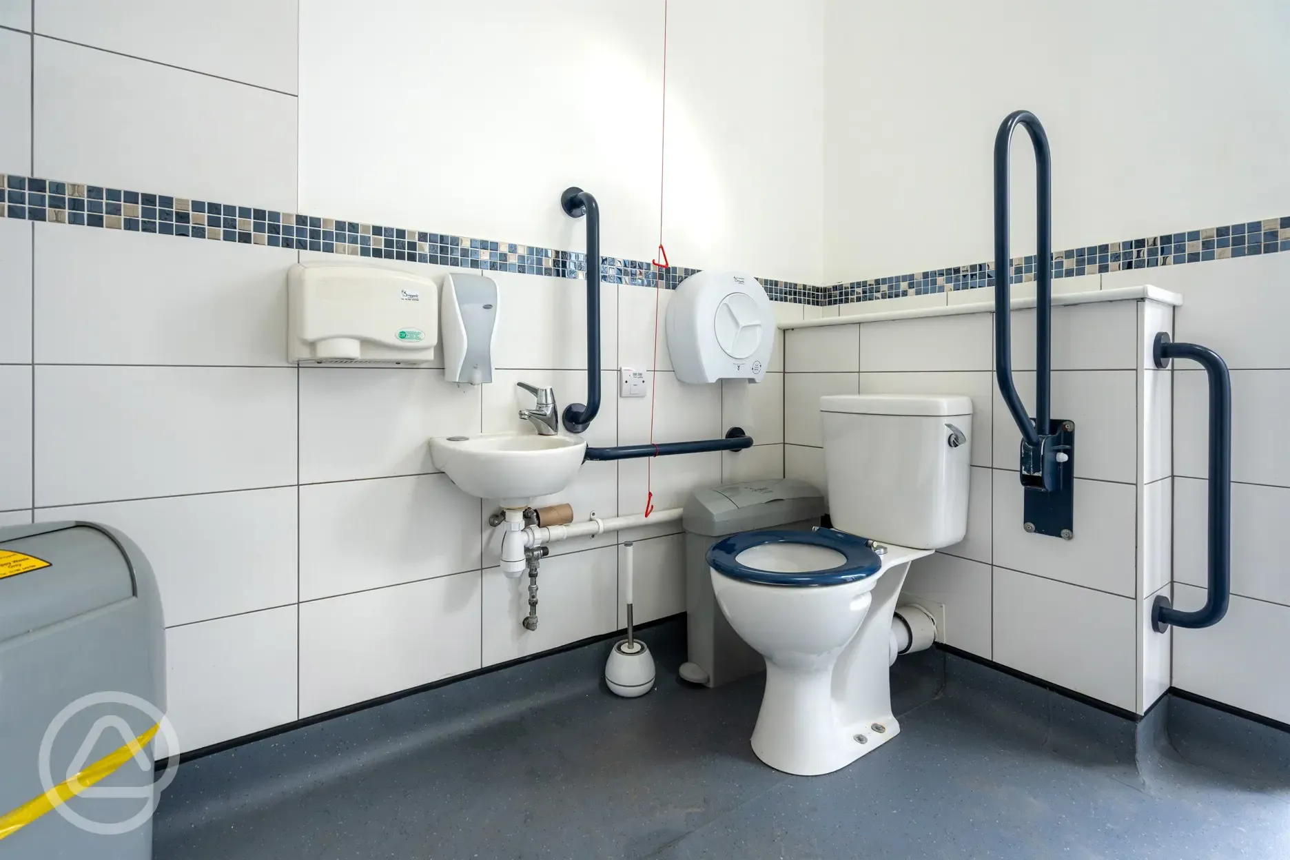 Accessible bathroom with grab rails at Oakwood Marina