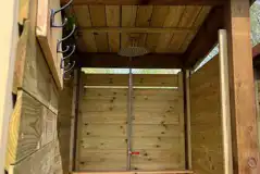 Shower shack interior with rainfall shower and hooks Shower shack interior with rainfall shower and hooks