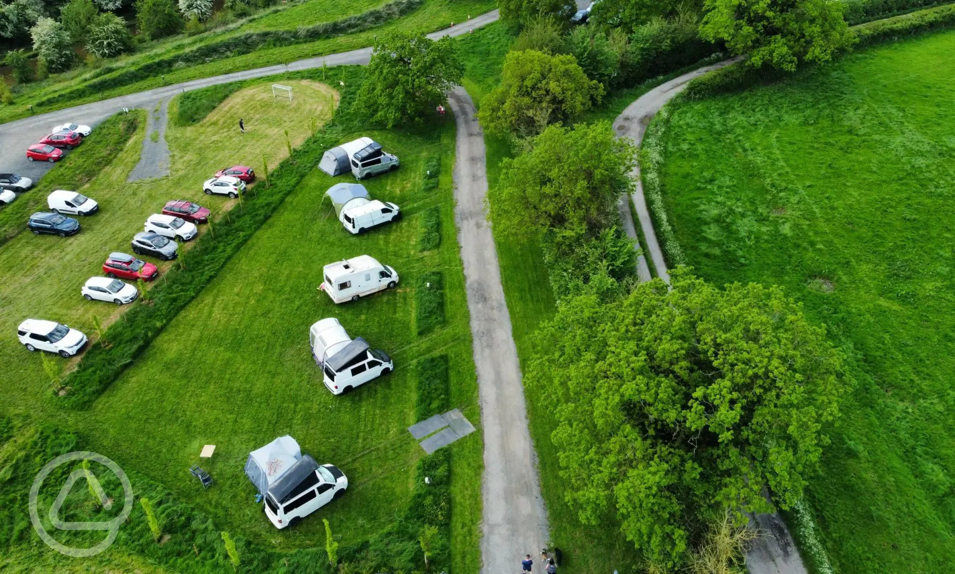Aerial of the electric grass touring pitches with 16 amp hook up (3m x 8m)