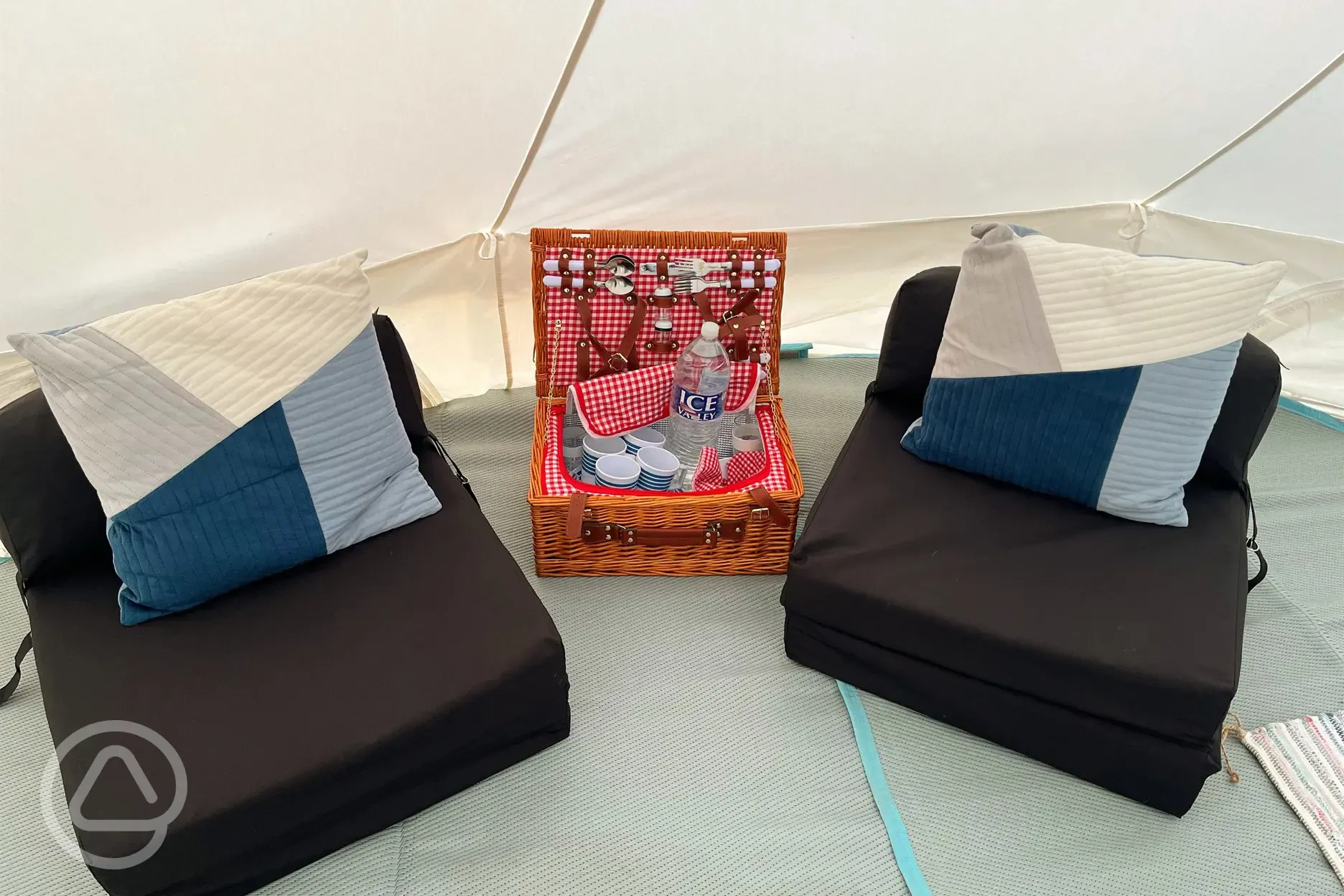 Bell tent seating area and picnic basket