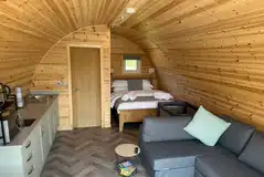 Ensuite glamping pod interior with space for a travel cot