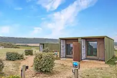 Glamping cabins with fencing between Glamping cabins with fencing between