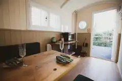 Shepherd's hut interior which converts into a double bed