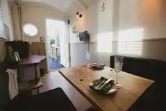 Shepherd's hut interior which converts into a double bed