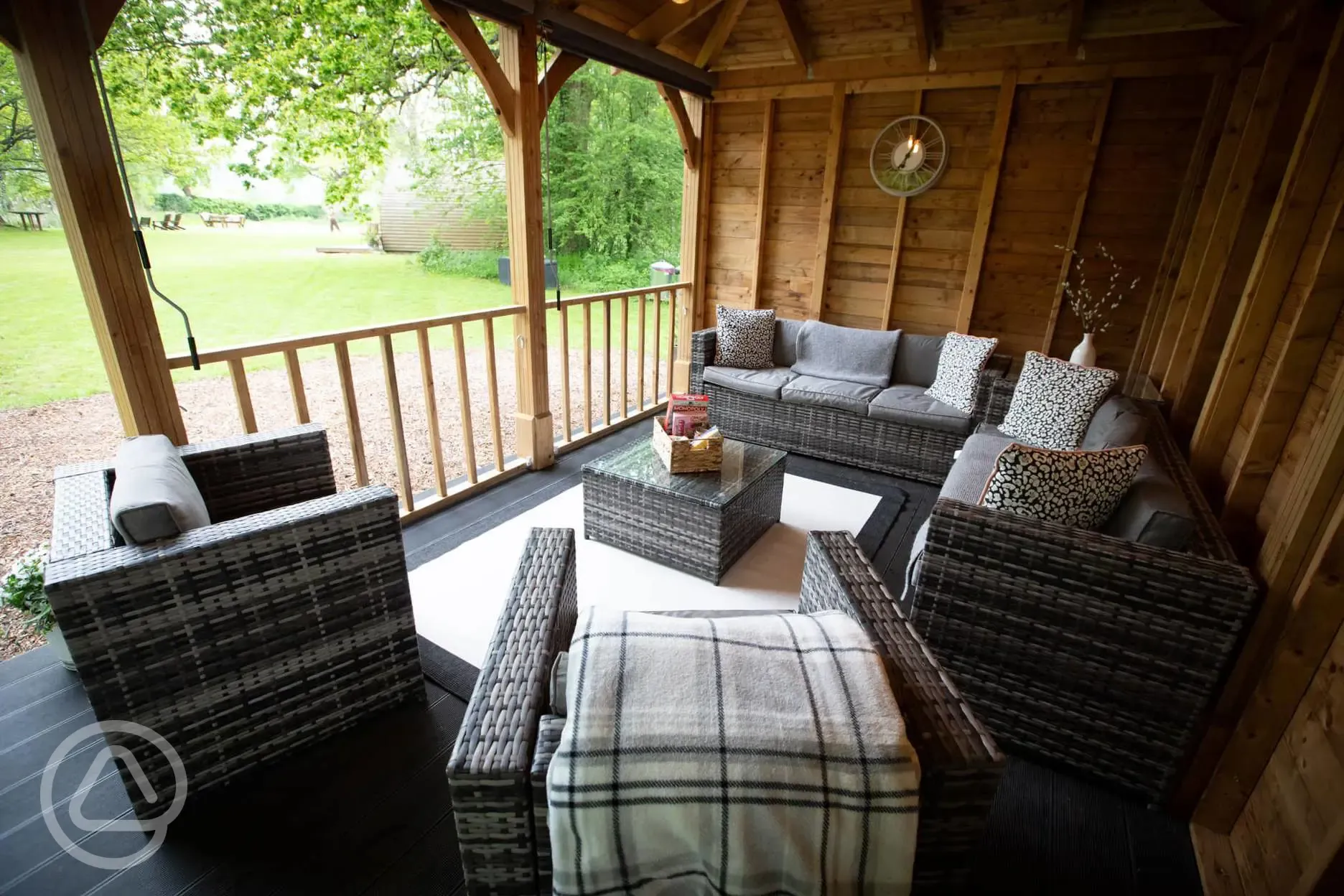 Gazebo in the meadow with seating, lighting and drinks fridge