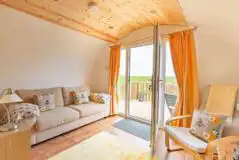 Sofa and chairs in the living room of The Bee Hive