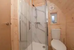 The Heron's Nest ensuite toilet, shower, and handwashing sink