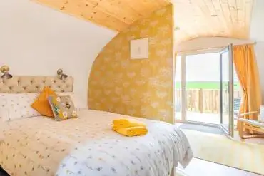 The Bee Hive king sized bed (bedding included) at The Galloway Steading
