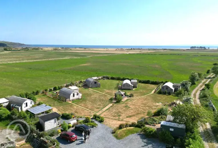 Aerial of The Galloway Steading towards the coast and Whitecrook Cove