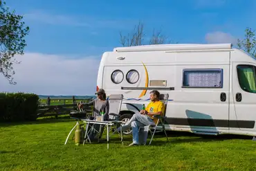 Campervan on an grass pitch at Ashbourne Touring and Camping Park