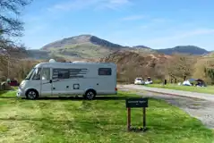 Electric hardstanding and grass pitches with views to Nantlle Ridge