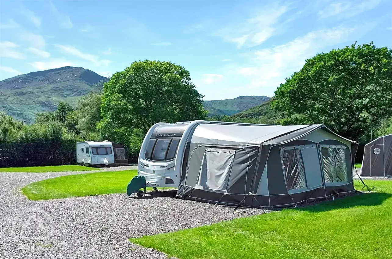 Electric hardstanding and grass pitches (awnings allowed)