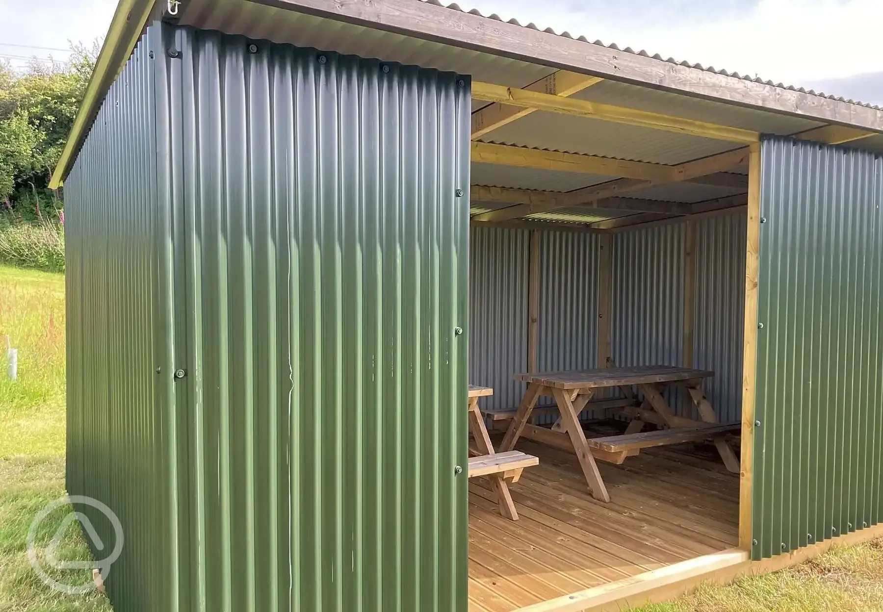 Sheltered seating area with picnic benches