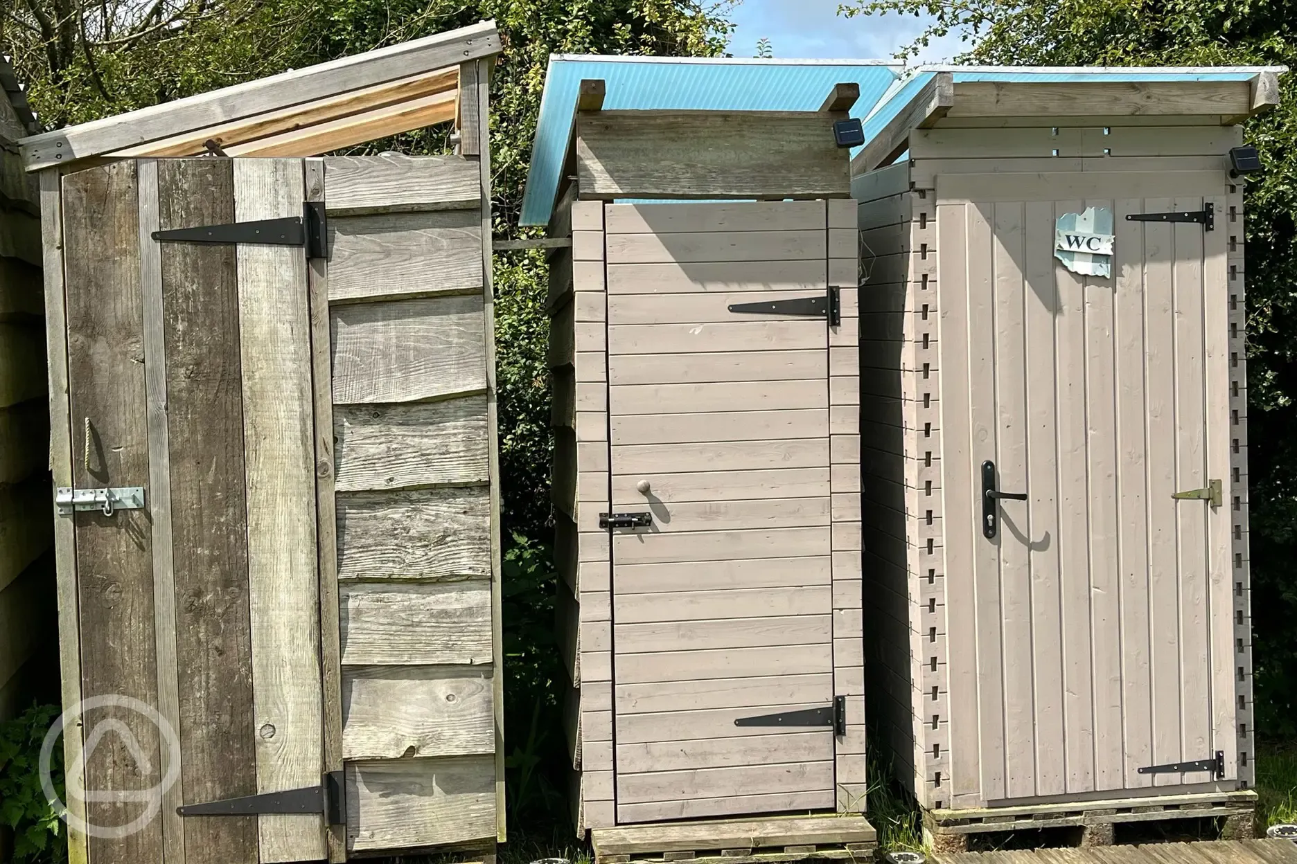 Facilities block with a hot shower, compost toilet, and urinal