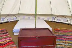 Five person bell tent interior with three extra airbeds available Five person bell tent interior with three extra airbeds available