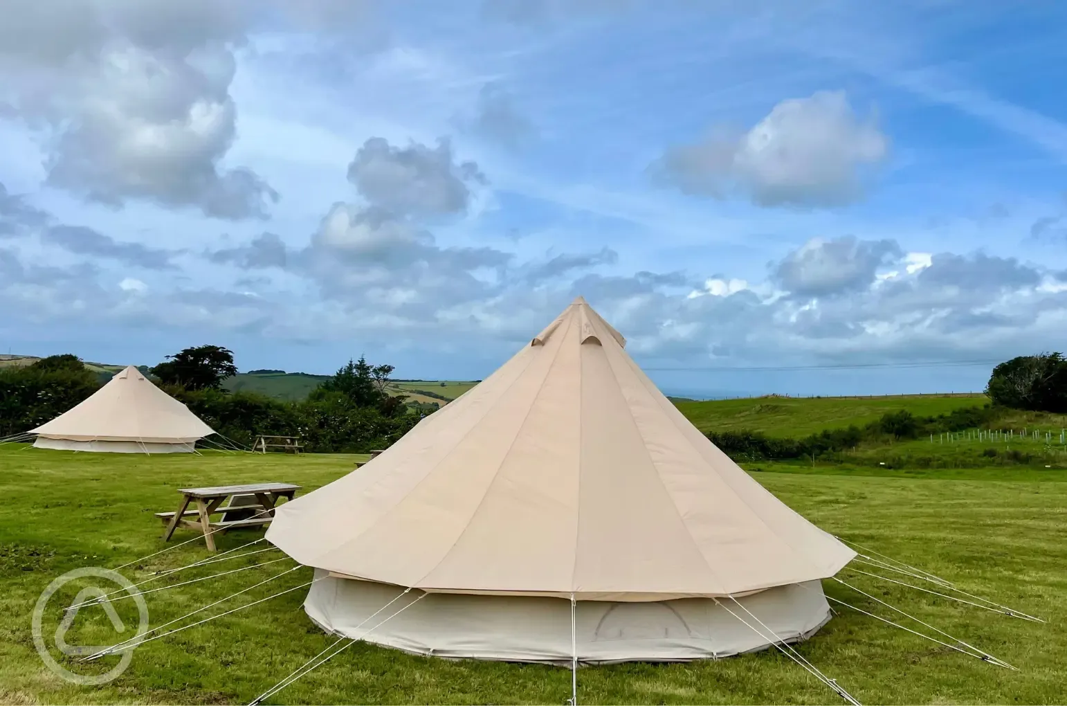 Five person bell tent at Giddy Farm with a picnic bench