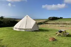 Bell tent with a picnic bench and BBQ at Giddy Farm Bell tent with a picnic bench and BBQ at Giddy Farm