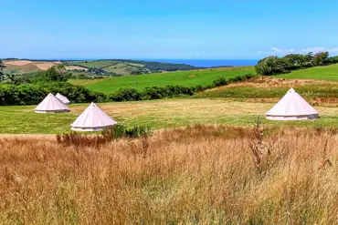 Bell tents at Giddy Farm with Combe Martin Bay sea views