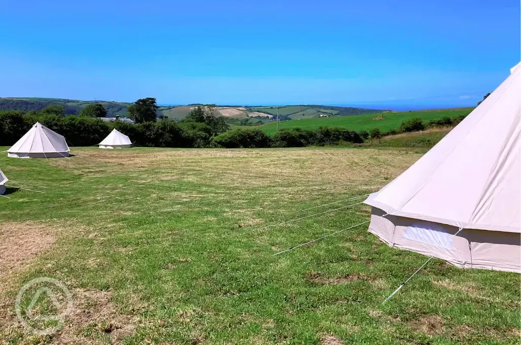 Bell tents at Giddy Farm with Combe Martin Bay sea views