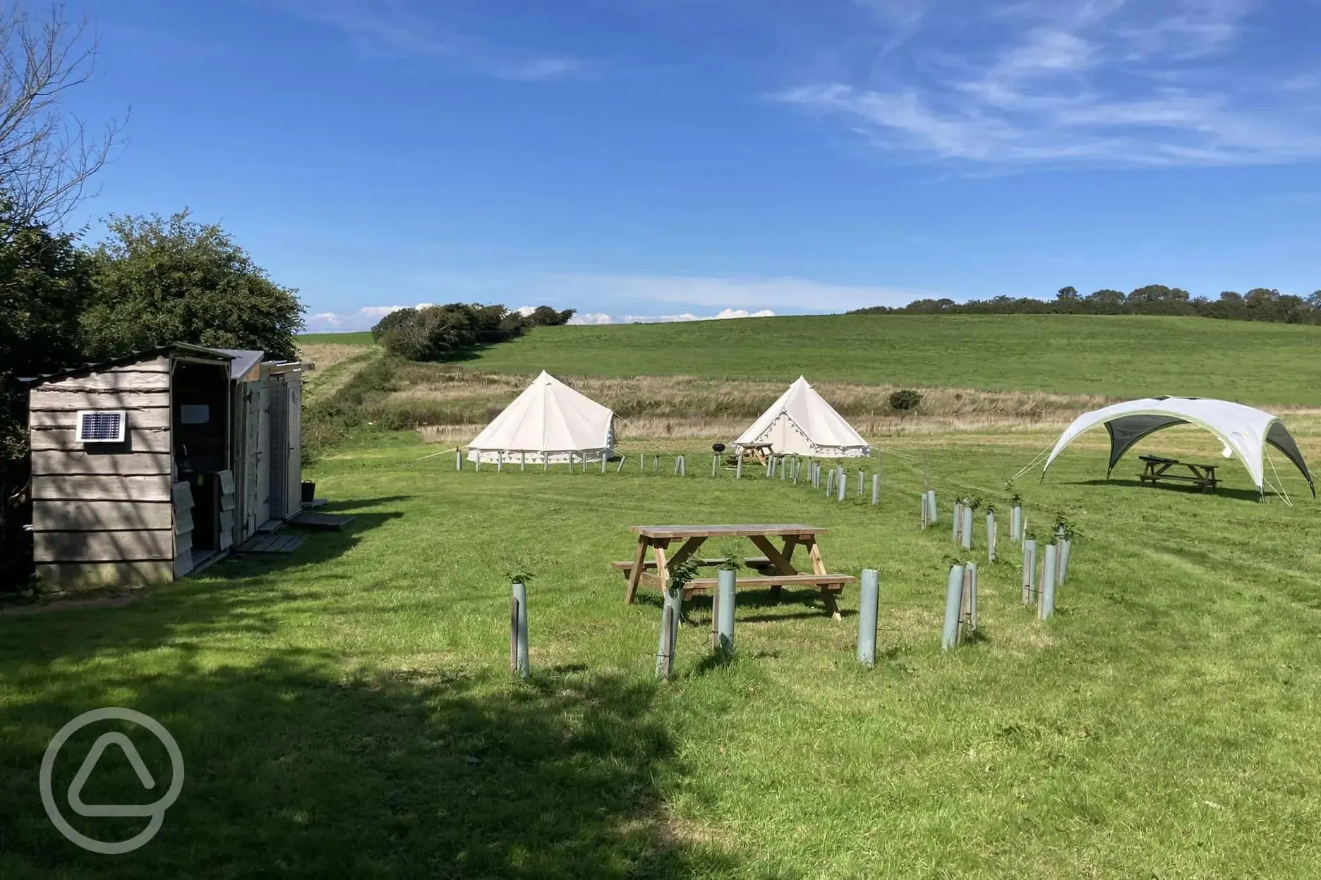 Bell tents near facilities block at Giddy Farm