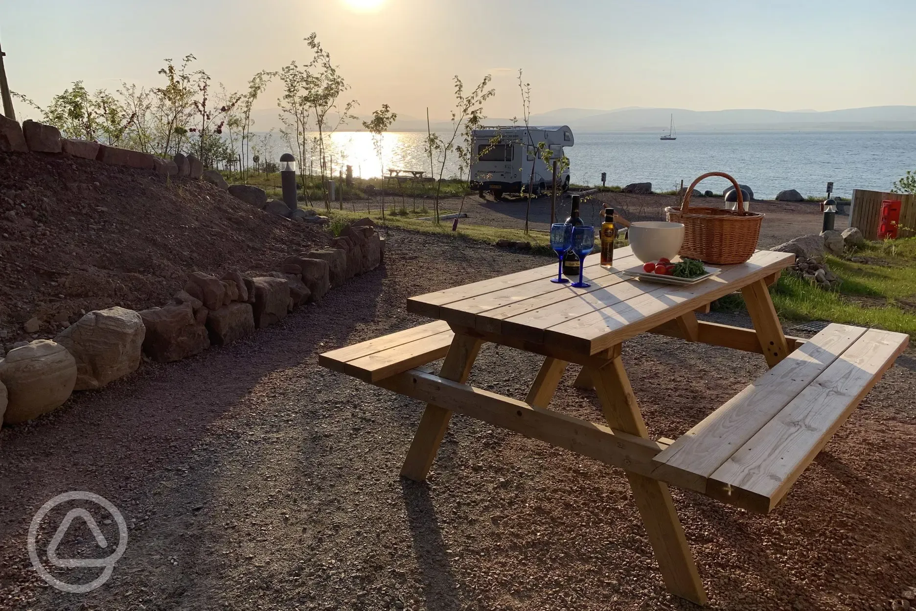 Cromarty Camping with sunset on pitches and Cromarty Firth