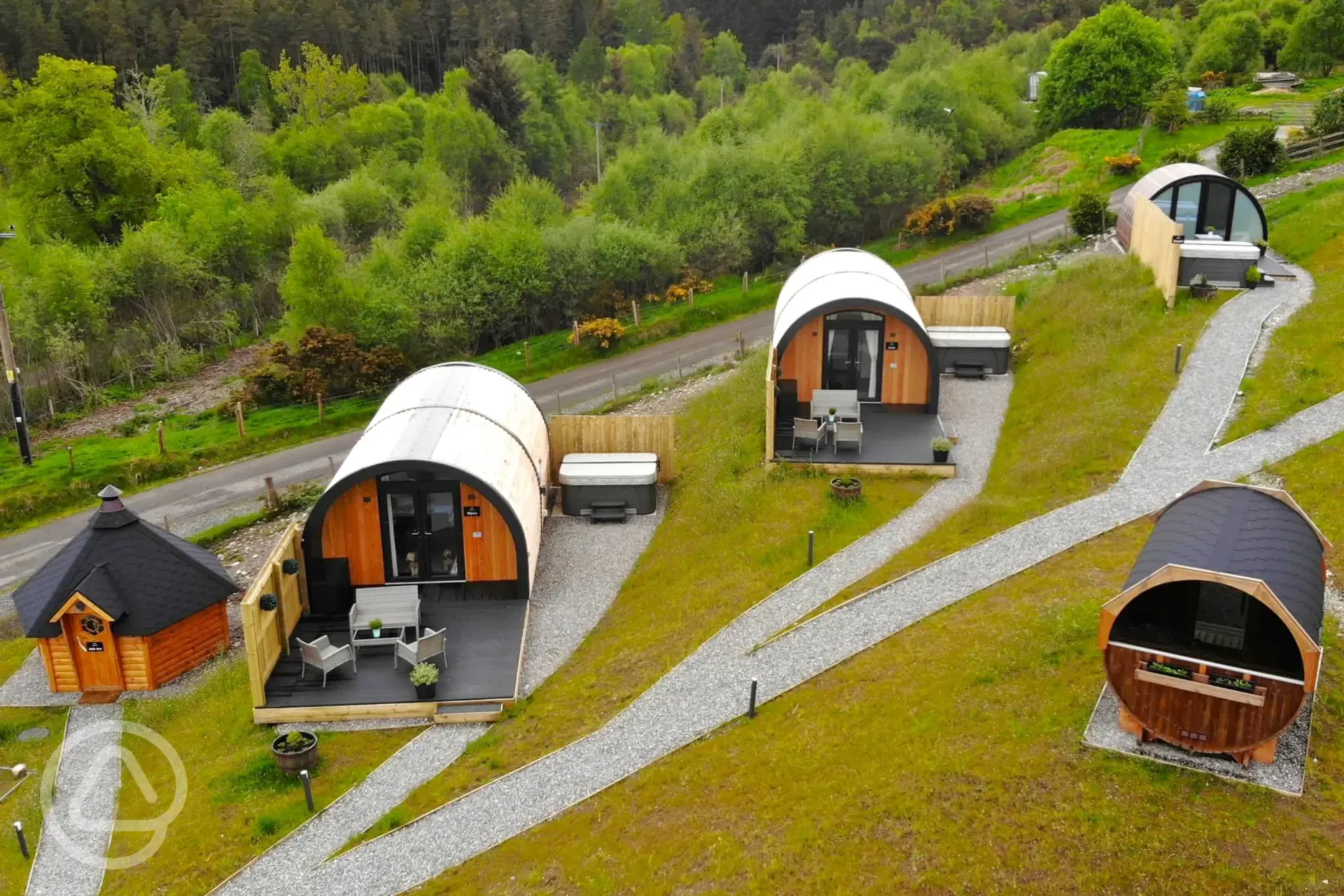 Glamping pods with the sauna and BBQ hut