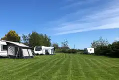 Non electric grass pitches at Tyn Cae Campsite