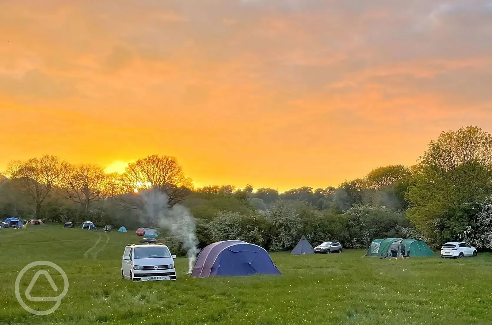 Non electric grass tent pitches at sunset