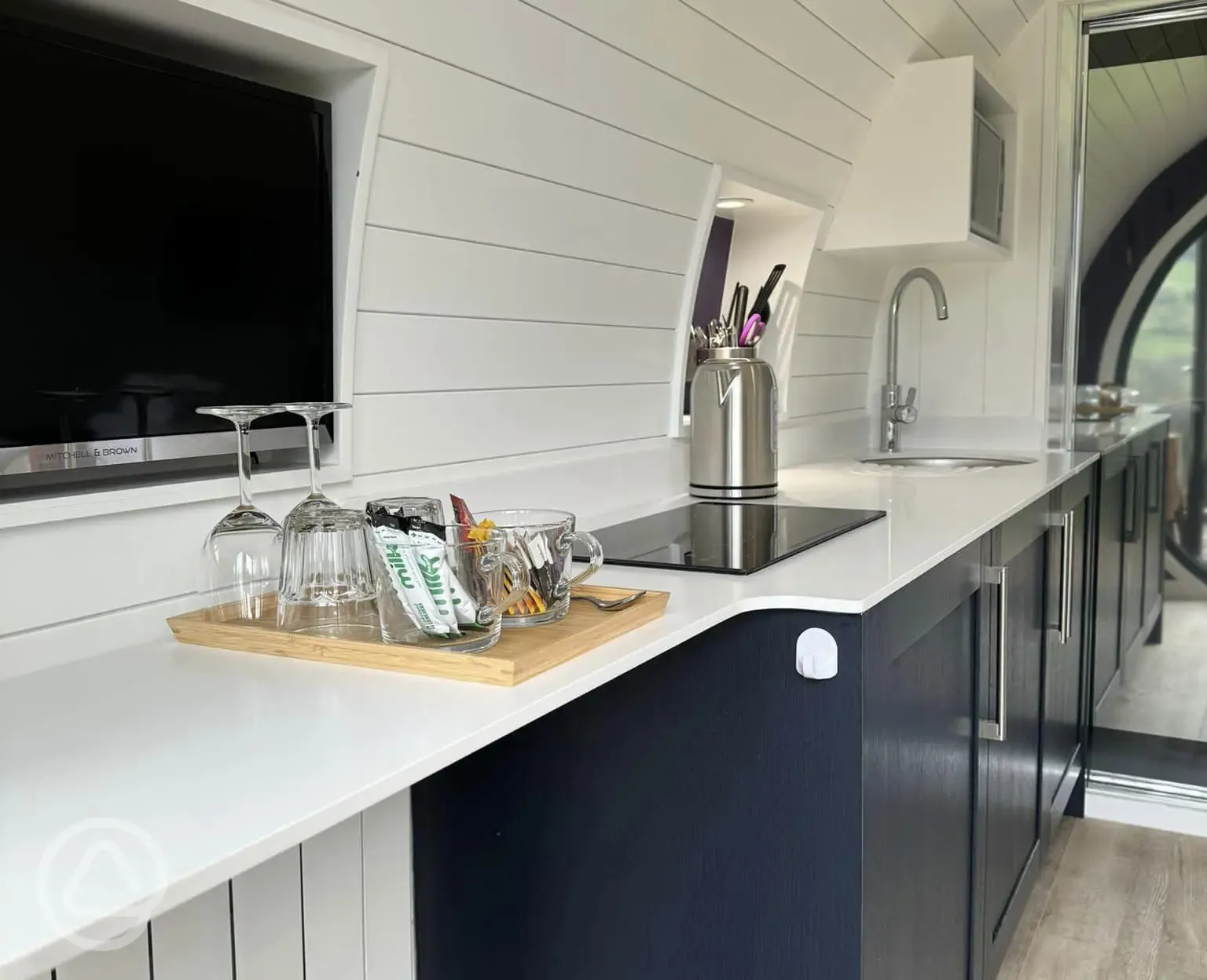 Glamping pod kitchen with microwave, induction hob, fridge, sink and air fryer