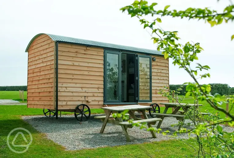 Shepherd's hut exterior at Treverven Farm Camping (four persons)