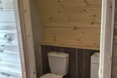 Glamping pod ensuite bathroom with toilet and sink Glamping pod ensuite bathroom with toilet and sink