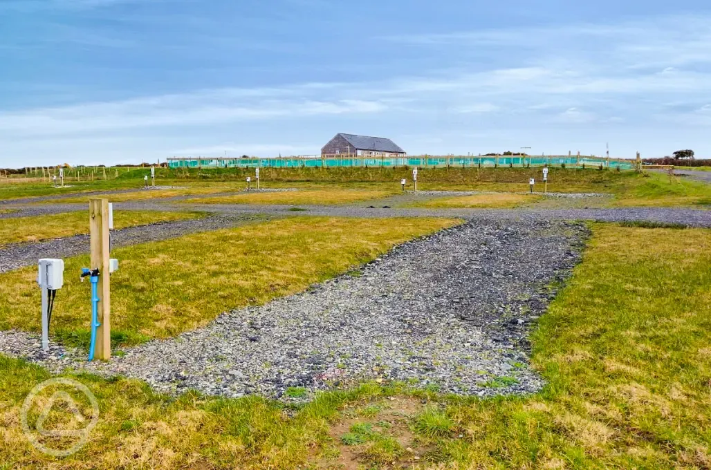 Grass and hardstanding touring pitches with optional electric