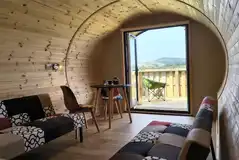 Glamping pod fold out click-clack beds and dining space with hillside views Glamping pod fold out click-clack beds and dining space with hillside views