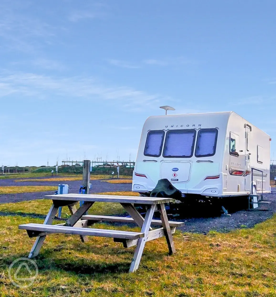 Grass and hardstanding touring pitches with optional electric