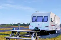 Grass and hardstanding touring pitches with optional electric