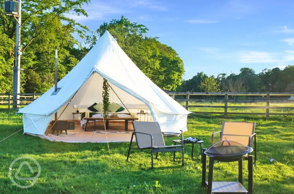 Bell tent and outdoor seating area