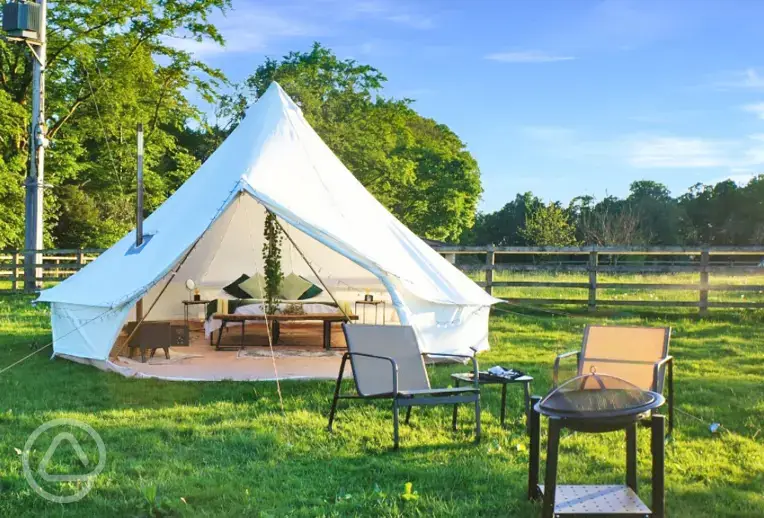 Bell tent and outdoor seating area