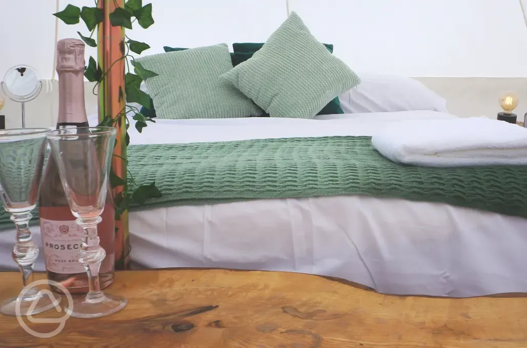 Bell tent double bed with prosecco